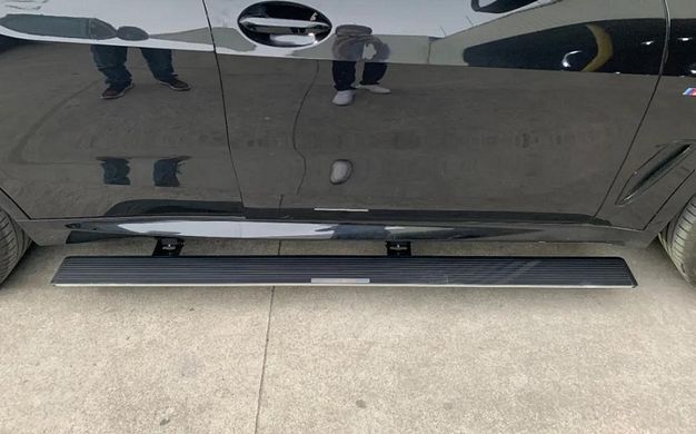 Пороги, подножки боковые BMW X5 G05 с выездным механизмом тюнинг фото