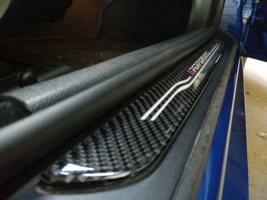 Накладки на пороги BMW тюнінг фото