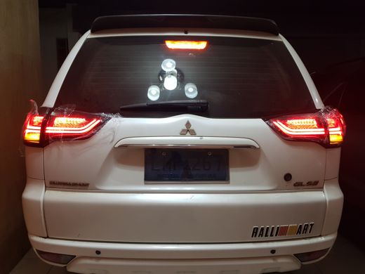 Оптика задняя, фонари Mitsubishi Pajero Sport, дымчатые (10-15 г.в.) тюнинг фото