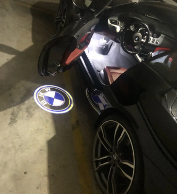 Подсветка дверей с логотипом авто БМВ тюнинг фото