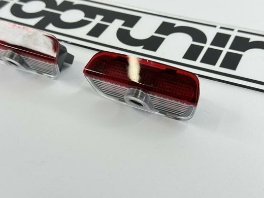 Підсвічування дверей з логотипом авто Фольксваген тюнінг фото